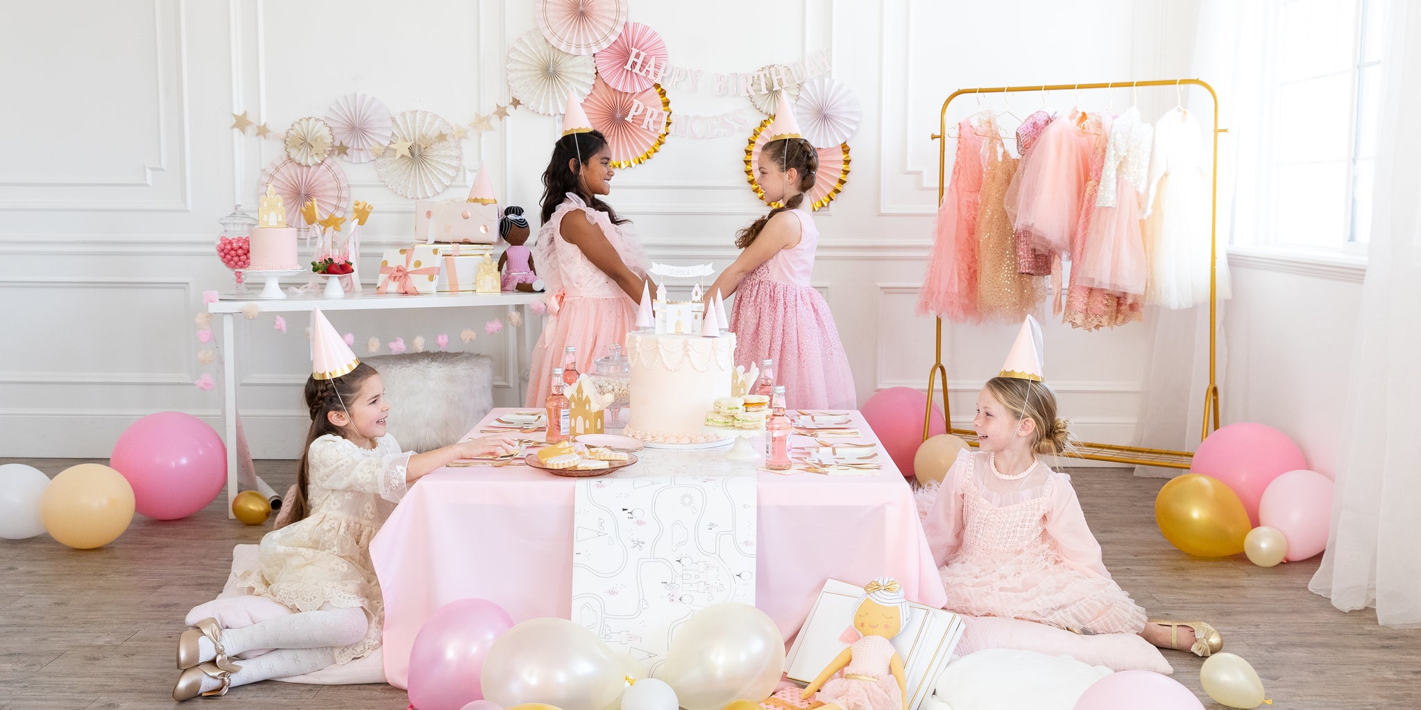 Princess Party Image. Collection of princess theme paper plates, paper cups, napkins, hanging decor and balloons to truly make your little one feel like a princess on her special day. 