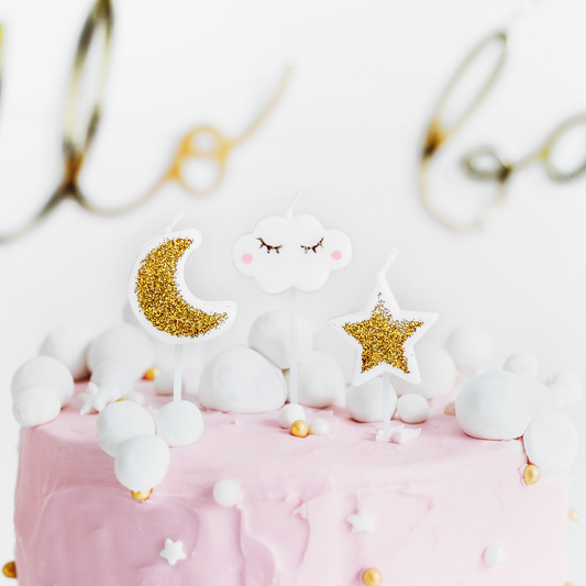 White Cloud shape, Gold star and moon shape candles on a cake setting