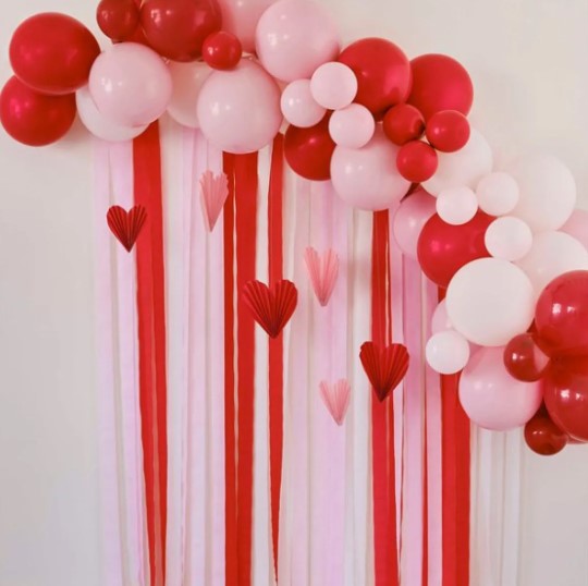 Red & Pink Balloon Arch Party Backdrop with Streamers and Paper Heart Decorations