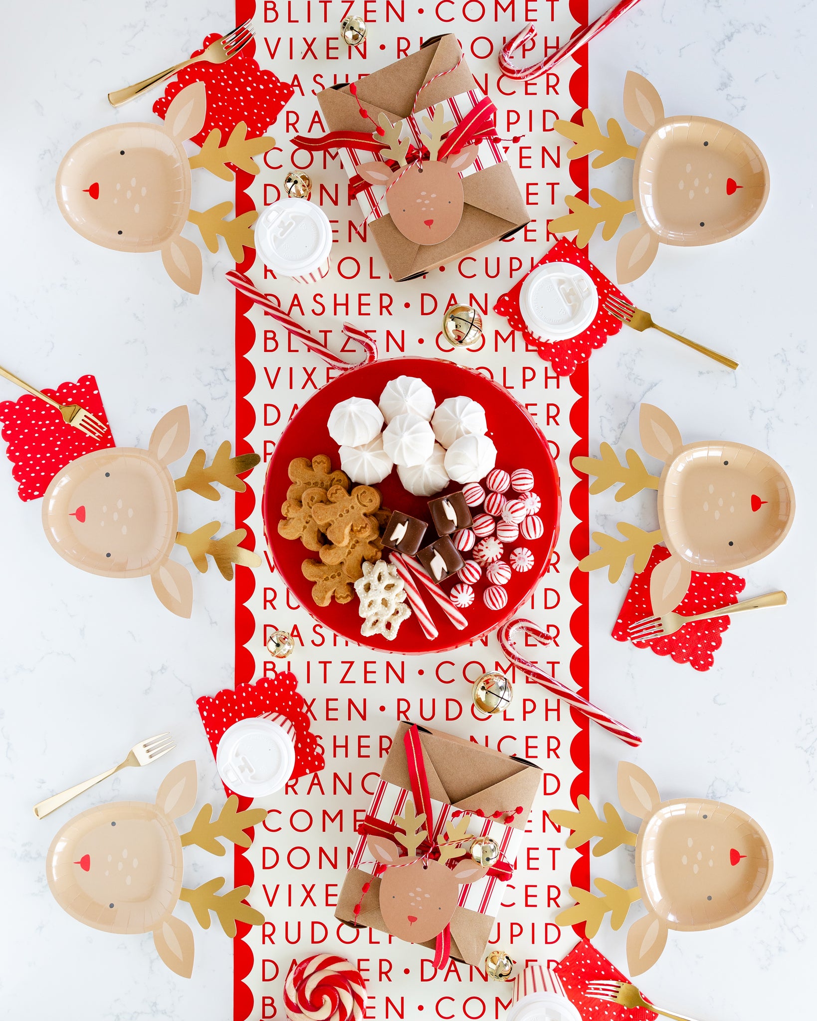 Dear Rudolph table setting. Red, white and gold theme. 