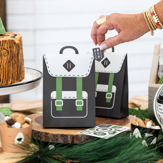 Black and Green backpack style treat/ favour party bags with sticker. This is an adventure/ happy camper birthday theme. 