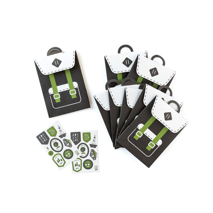 Black and Green backpack style treat/ favour party bags with sticker. This is an adventure/ happy camper birthday theme.