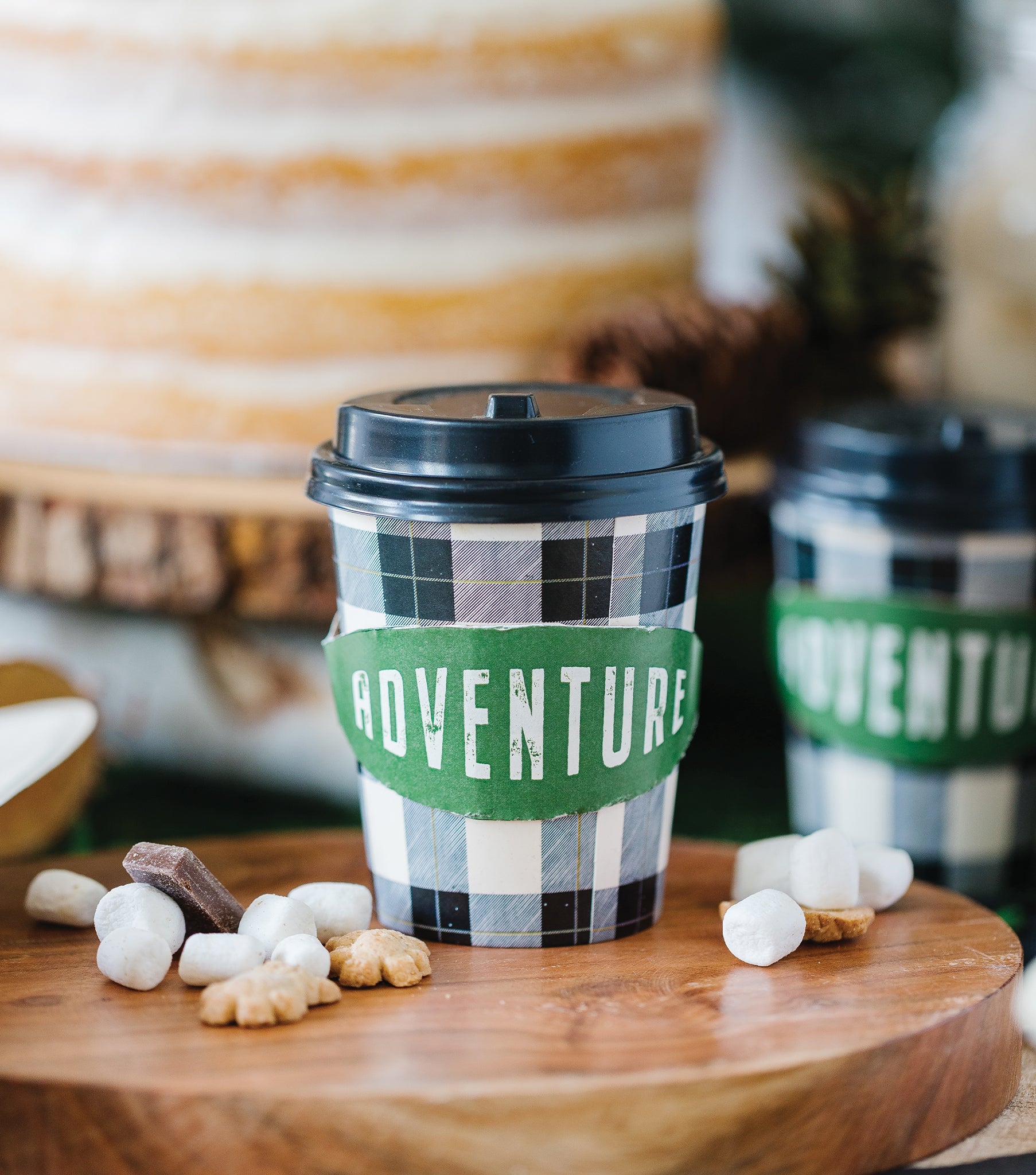 Rustic Balck and White Check Paper cup with green and white writing 'adventure' sleeve. plastic lid included too. Paper go-to paper cups